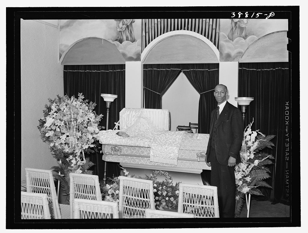 Undertaker before funeral services. Southside, Chicago, Illinois. Image via Library of Congress