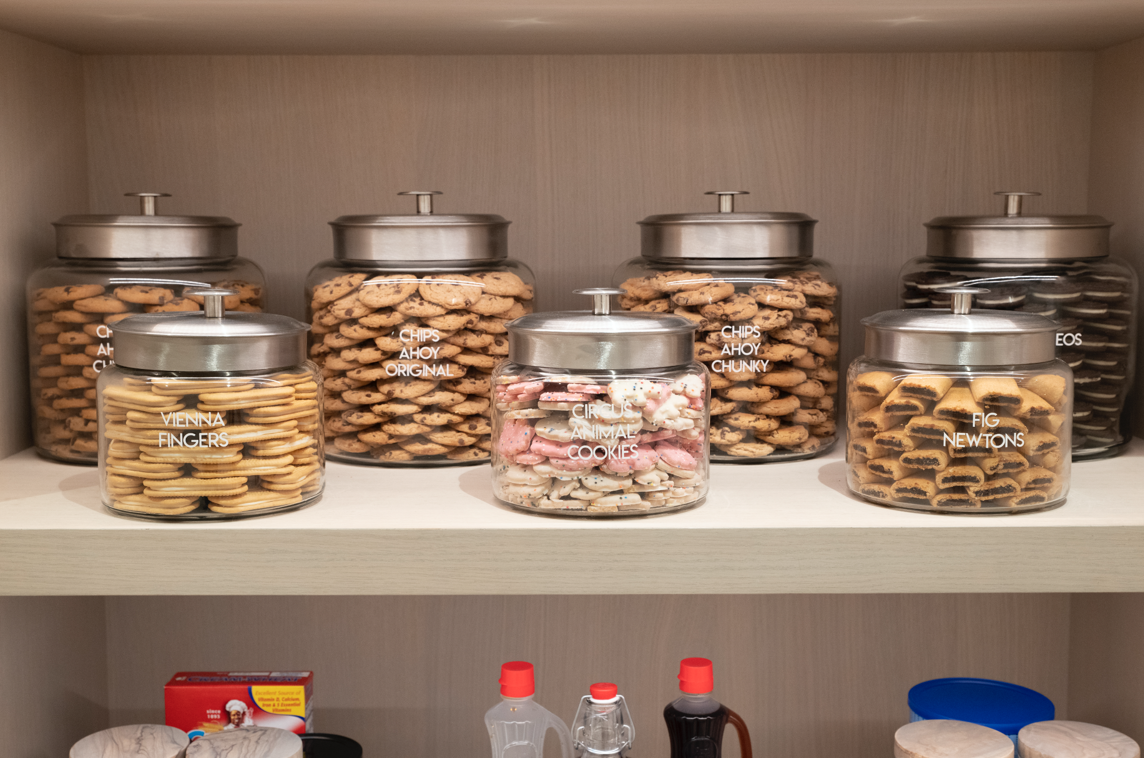glass jars of cookies carefully arranged on a shelf