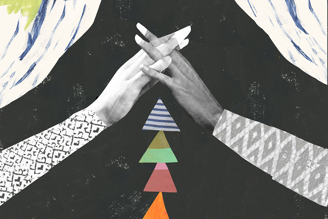 Two hands interlace in a pyramid shape above a precarious pile of triangles